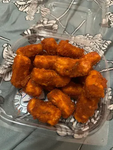 Paneer pakora in a takeout container at Lovely Sweets Saddletowne Calgary