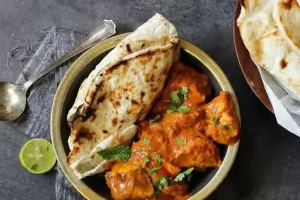 Garlic Naan - tandoor-baked naan served with North Indian curry at Lovely Sweets Calgary